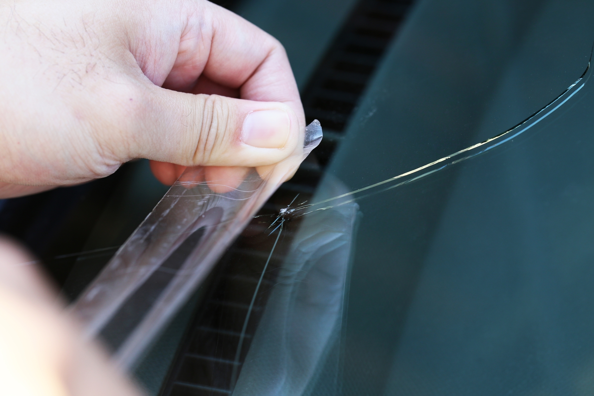 Clear Tape on Windshield Crack as a Barrier